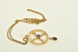 AN EDWARDIAN 9CT GOLD AMETHYST AND SPLIT PEARL PENDANT, designed as an openwork target set with