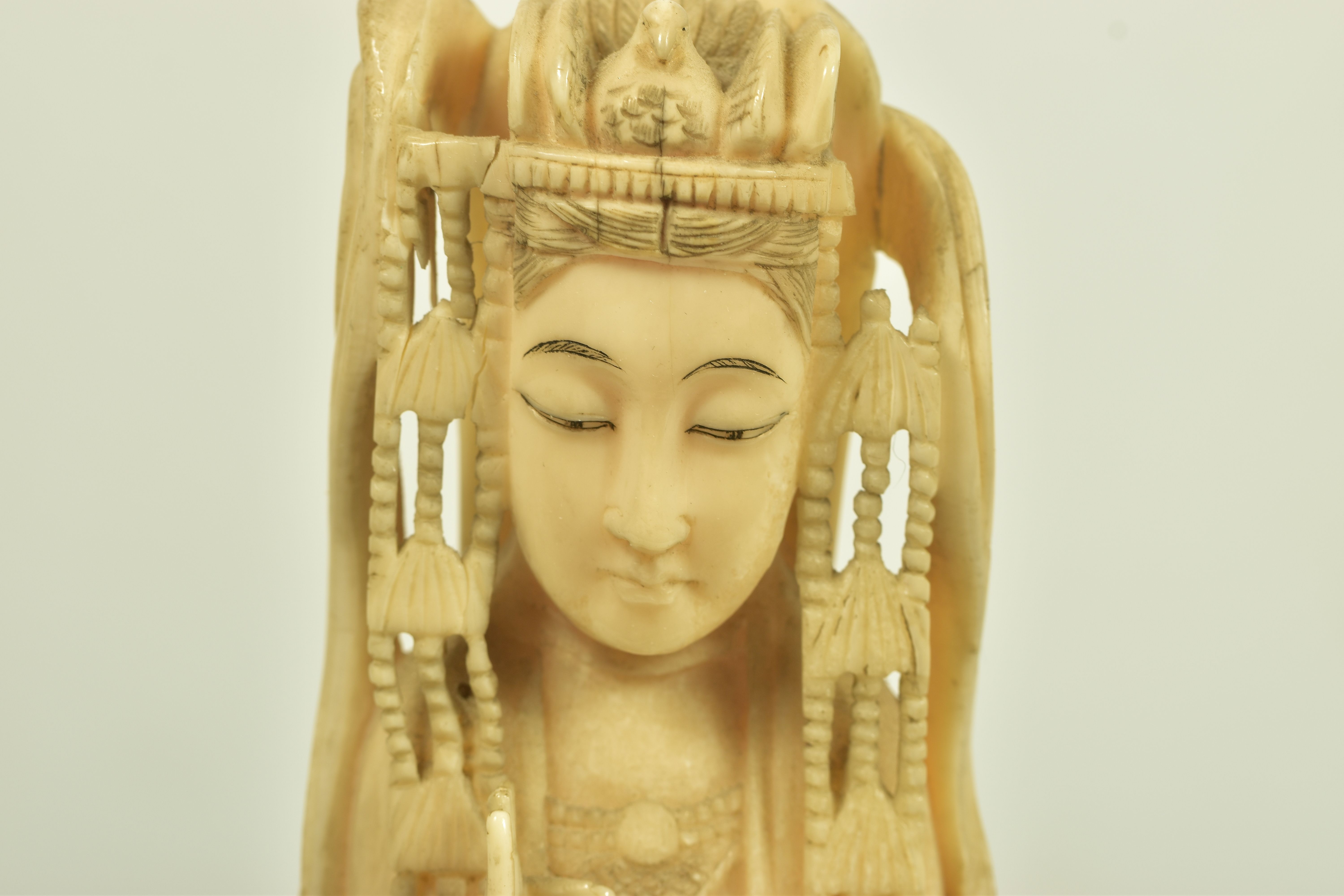 A LATE 19TH CENTURY CARVED IVORY FIGURE, depicting an oriental lady carrying a basket, with a bird - Image 2 of 4