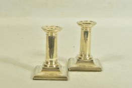 A PAIR OF SILVER DWARF CANDLE STICK HOLDERS BY HORACE WOODWARD & CO LTD, each designed as plain