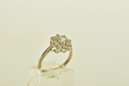 AN 18CT YELLOW GOLD SPINEL FLORAL CLUSTER RING, designed as a flower cluster set with nine