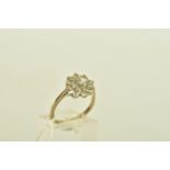 AN 18CT YELLOW GOLD SPINEL FLORAL CLUSTER RING, designed as a flower cluster set with nine