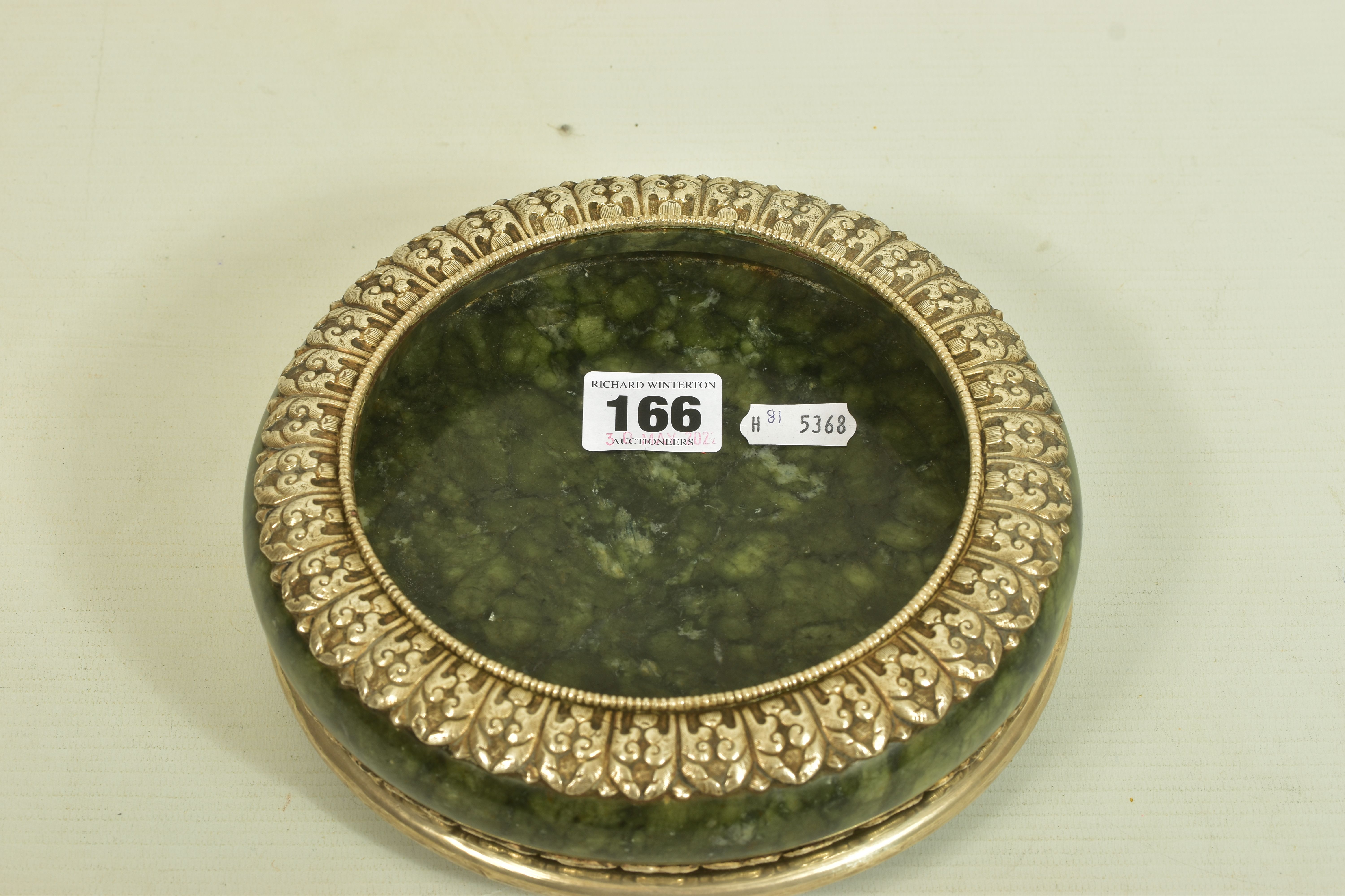 A WHITE METAL JADE BOWL AND STAND, believed to be 'Serpentine Jade,' with a white metal decorative