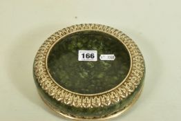 A WHITE METAL JADE BOWL AND STAND, believed to be 'Serpentine Jade,' with a white metal decorative