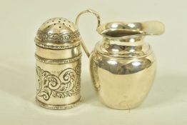 A LATE VICTORIAN PEPPER POT AND AN EDWARDIAN SILVER JUG, the first a late Victorian engraved