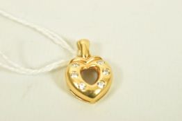 A YELLOW METAL DIAMOND HEART PENDANT, an openwork heart shape pendant set with six brilliant cut