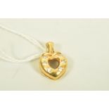 A YELLOW METAL DIAMOND HEART PENDANT, an openwork heart shape pendant set with six brilliant cut