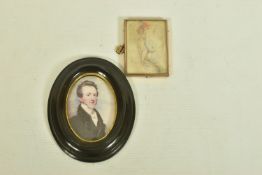 A WOODEN PORTRAIT MINIATURE AND A HAND DRAWING OF A LADY, the first depicting a Georgian gentleman