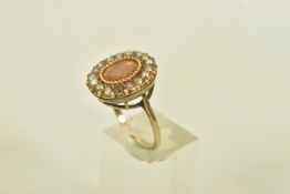 A FOIL BACKED TOPAZ AND SPLIT PEARL YELLOW GOLD CLUSTER RING, set with an oval shaped foil backed