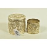 TWO EARLY 20TH CENTURY ITEMS, the first an embossed unmarked white metal pot depicting a hunting