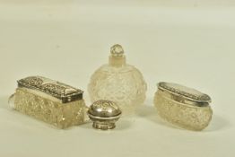 TWO EDWARDIAN SILVER AND GLASS VANITY JARS AND A SCENT BOTTLE, to include two textured glass boxes