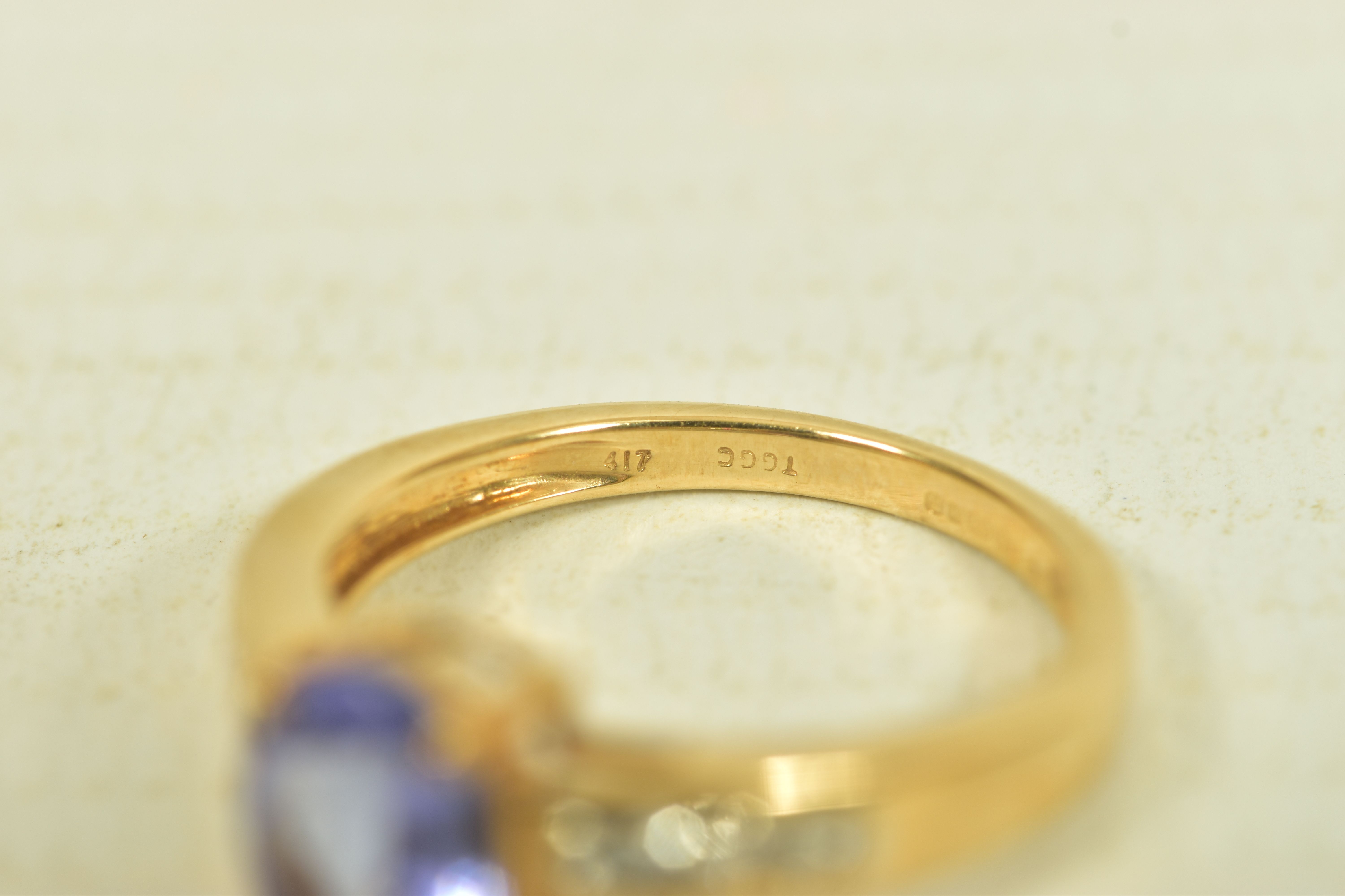 A 9CT GOLD TANZANITE AND COLOURLESS GEM DRESS RING, the oval tanzanite, to the circular colourless - Image 5 of 6