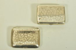 TWO EARLY 20TH CENTURY SILVER CIGARETTE CASES, the first with floral engraving and personal monogram