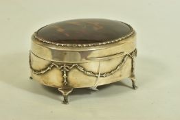 AN EARLY 20TH CENTURY SILVER AND TORTOISESHELL HINGED BOX, the oval trinket box with embossed