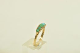 A 1970s 9CT GOLD TURQUOISE FIVE STONE RING, the graduated turquoise cabochon line with scroll detail