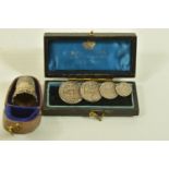 A CASED EARLY 20TH CENTURY SILVER THIMBLE AND A CASED MAUNDY COIN BROOCH, the first with scroll