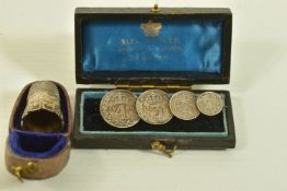 A CASED EARLY 20TH CENTURY SILVER THIMBLE AND A CASED MAUNDY COIN BROOCH, the first with scroll