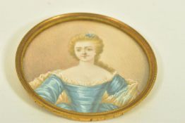 A LATE VICTORIAN MINIATURE PORTRAIT, depicting an elegant lady painted on ivory, within a base metal