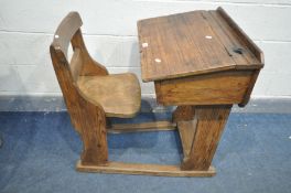 A VICTORIAN PITCH PINE AND ELM CHILDS SCHOOL DESK, with a hinge top lid, width 57cm x depth 88cm x