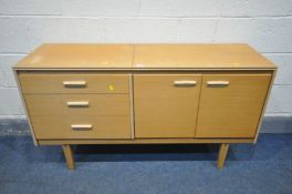 A MID CENTURY LEBUS TEAK DRESSING TABLE, with single hinged top enclosing an adjustable mirror,