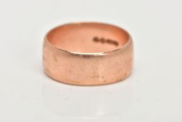A 9CT GOLD BAND RING, a plain polished courted rose gold, band ring, approximate width 8mm,
