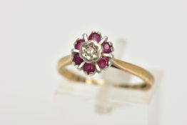 AN 18CT GOLD GEM SET CLUSTER RING, flower shape cluster set with a central single cut diamond within