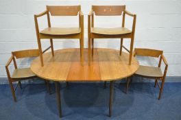 A MID CENTURY TEAK CIRCULAR EXTENDING DINING TABLE, with a single fold out leaf, extended leaf 150cm