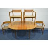 A MID CENTURY TEAK CIRCULAR EXTENDING DINING TABLE, with a single fold out leaf, extended leaf 150cm