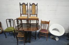 AN OAK BARLEY TWIST GATE LEG TABLE, two oak dining chairs, two mahogany splat back chair, a press
