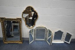 AN ATTEWELL GILTWOOD BEVELLED EDGE RECTANGULAR WALL MIRROR, with foliate border, ebonised trim and