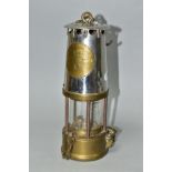 A MINER'S SAFETY LAMP, of brass and chrome construction marked 'The Protector Lamp and Lighting