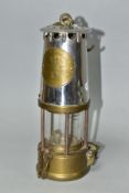 A MINER'S SAFETY LAMP, of brass and chrome construction marked 'The Protector Lamp and Lighting