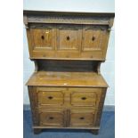 AN EARLY 20TH CENTURY OAK PANTRY CUPBOARD, the top with three cupboard doors above three drawers,