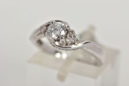 AN 18CT WHITE GOLD DIAMOND RING, the brilliant cut diamond with asymmetric brilliant cut diamond