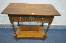 AN OAK SIDE TABLE, with a single frieze drawer, on turned legs, united by an undershelf, width