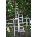 A SET OF DOUBLE EXTENSION LADDERS, with wheels, length 3.5M together with a platform ladder with 2 x