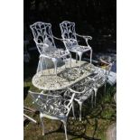 A WHITE PAINTED OVAL ALUMINIUM GARDEN TABLE with an under tier, length 140cm x width 82cm together