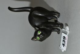 A WEDGWOOD ETRURIA BLACK BASALT CAT WITH GREEN GLASS EYES DESIGNED BY ERNEST LIGHT, impressed marks,