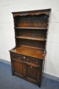 A SLIM REPRODUCTION OAK DRESSER, with two drawers, width 92cm x depth 40cm x height 175cm x height