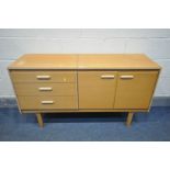 A MID CENTURY LEBUS TEAK DRESSING TABLE, with single hinged top enclosing an adjustable mirror,