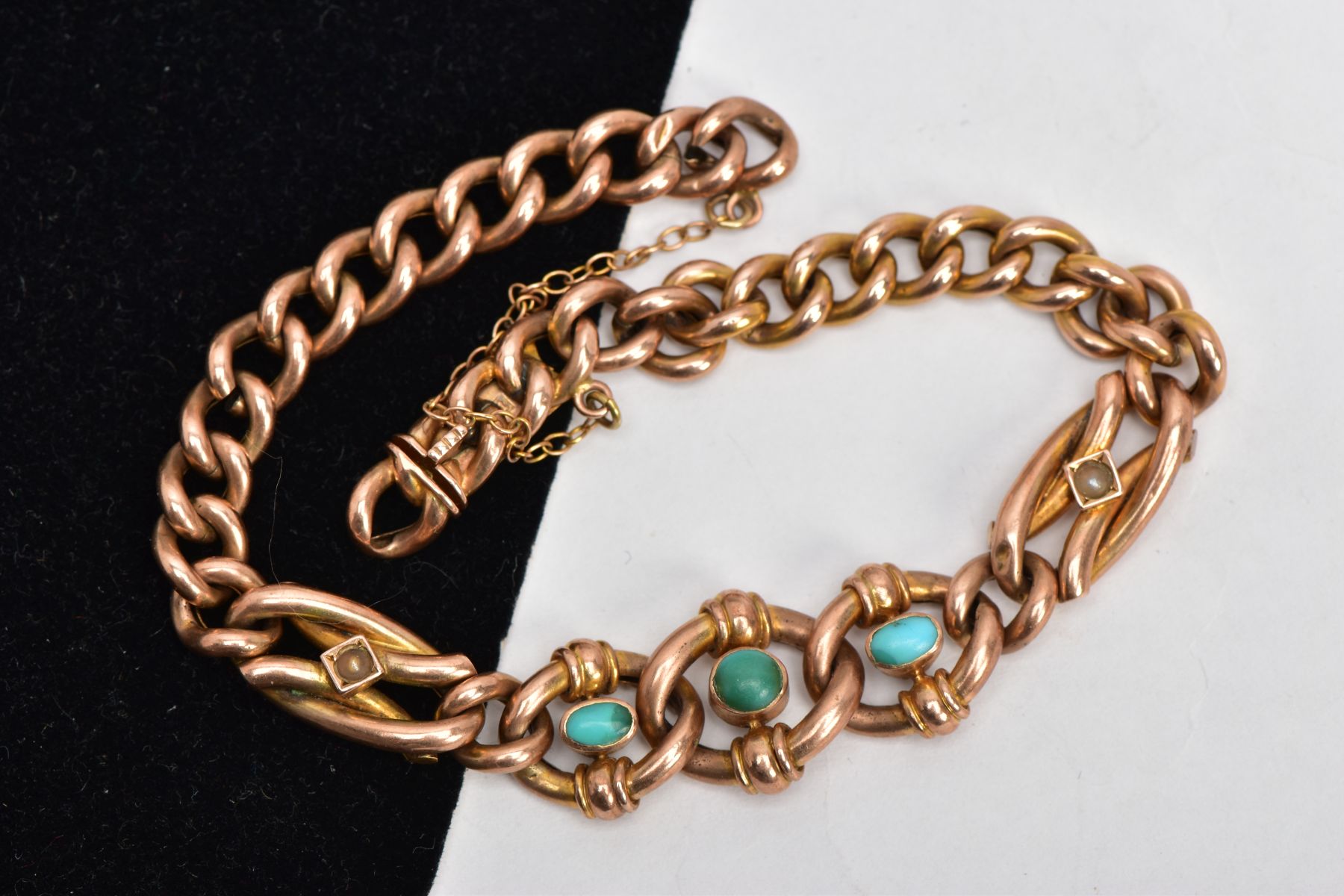 A VICTORIAN GOLD BRACELET, hollow curb link bracelet, centring with three circular links set with