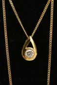 A 9CT GOLD DIAMOND NECKLACE, a pear-shaped yellow gold pendant set with a round brilliant cut