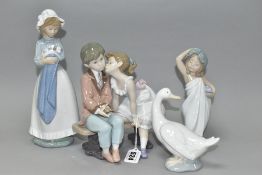 TWO LLADRO FIGURES AND TWO NAO FIGURES, comprising 'Ten and Growing' No 7635, depicting girl kissing