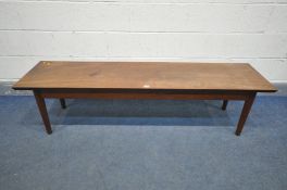 A 1960'S LONG RECTANGULAR DANISH STYLE SOLID MAHOGANY TOP COFFEE TABLE, on a teak base with