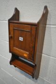 AN ERCOL GOLDEN DAWN ELM WALL HANGING KEY CABINET, width 27cm x height 58cm