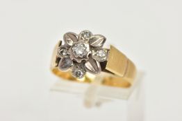 A WHITE AND YELLOW METAL DIAMOND CLUSTER RING, a floral design ring in white metal set with a