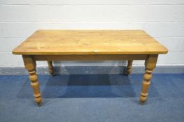 A 20TH CENTURY PINE RECTANGULAR KITCHEN TABLE, on block and turned legs length 153cm x depth 83cm