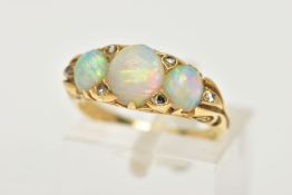 AN OPAL AND DIAMOND RING, a yellow metal ring, set with three oval opals, accented with six rose cut