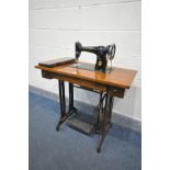 A VINTAGE SINGER TREDLE SEWING MACHINE, width 87cm x depth 42cm x height 74cm