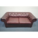 A BURGUNDY LEATHERETTE CHESTERFIELD SOFA BED, length 180cm x depth 83cm x height 66cm (condition:-