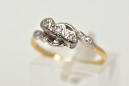 A WHITE AND YELLOW METAL DIAMOND RING, a single round brilliant cut diamond and two rose cut